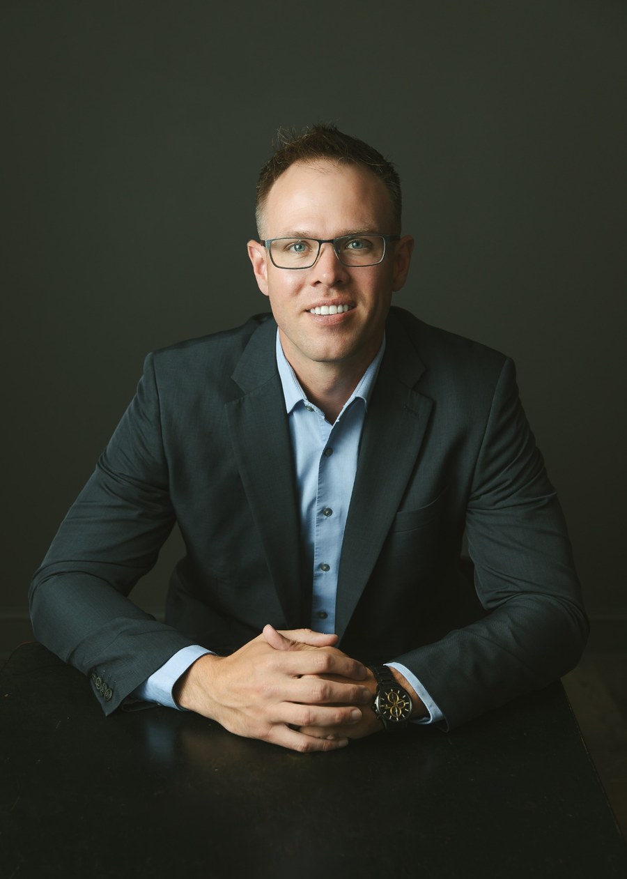 Todd Herman seated for a professional portrait